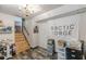 A basement with a sign and stairs leading to a different space at 2642 Bridgehampton Sw Rd, Marietta, GA 30064
