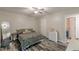 Relaxing bedroom features wood-look floors, neutral walls, ample natural light, and a large queen bed at 2642 Bridgehampton Sw Rd, Marietta, GA 30064