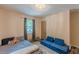 Cozy bedroom with natural light, showcasing neutral walls, playful decor, and comfortable furnishings for relaxation at 2642 Bridgehampton Sw Rd, Marietta, GA 30064