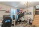 Bedroom with an American flag, shelves, desks, gaming chairs, and stairs to another room at 2642 Bridgehampton Sw Rd, Marietta, GA 30064