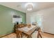 Dining room featuring hardwood floors, a wooden table, and natural light from the patio door at 2642 Bridgehampton Sw Rd, Marietta, GA 30064