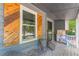 Cozy front porch with seating, decorative shutters, and a welcoming entrance at 2642 Bridgehampton Sw Rd, Marietta, GA 30064