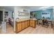 Inviting kitchen features ample cabinetry, modern lighting, and an adjacent dining area with seating for Gathering meals at 2642 Bridgehampton Sw Rd, Marietta, GA 30064