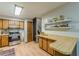 Functional kitchen with wooden cabinets, updated appliances, and hardwood floors at 2642 Bridgehampton Sw Rd, Marietta, GA 30064