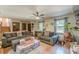 Cozy living room featuring hardwood floors and natural light from the surrounding windows at 2642 Bridgehampton Sw Rd, Marietta, GA 30064