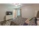 Inviting bedroom featuring a large window, wood-look floors, and neutral colors creating a calming retreat at 2642 Bridgehampton Sw Rd, Marietta, GA 30064