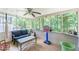 A screened porch with a view of the wooded backyard at 2642 Bridgehampton Sw Rd, Marietta, GA 30064