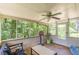 Inviting screened porch offers relaxing space and views of the lush, mature backyard trees at 2642 Bridgehampton Sw Rd, Marietta, GA 30064