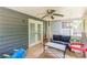 Cozy screened porch with ceiling fan, outdoor seating, and view of the outdoors at 2642 Bridgehampton Sw Rd, Marietta, GA 30064