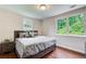 Comfortable bedroom with two windows, hardwood floors, and modern decor at 2742 Alpine Rd, Atlanta, GA 30305