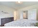 Inviting bedroom featuring a gray dresser, calming wall art and a gray and white patterned bedspread at 2742 Alpine Rd, Atlanta, GA 30305