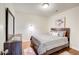 Cozy bedroom with hardwood floors, neutral paint, comfortable bed, and tasteful decor at 2742 Alpine Rd, Atlanta, GA 30305