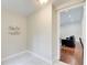 Hallway featuring tile floor and decorative wall, with views into the living room and an additional room at 2742 Alpine Rd, Atlanta, GA 30305
