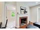 Living room with fireplace and view into spare room; hardwood floors and neutral walls at 2742 Alpine Rd, Atlanta, GA 30305