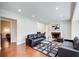 Spacious living room with hardwood floors, fireplace, recessed lighting, and stylish modern furniture at 2742 Alpine Rd, Atlanta, GA 30305