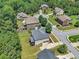 Aerial view of several houses in a wooded residential neighborhood at 271 Learwood Ln, Atlanta, GA 30349