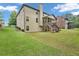 Spacious backyard featuring a large lawn and a wooden deck, perfect for outdoor enjoyment and entertaining at 271 Learwood Ln, Atlanta, GA 30349
