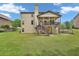Backyard view of deck with stairs to the lawn at 271 Learwood Ln, Atlanta, GA 30349