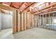 Unfinished basement with exposed beams and concrete floor at 271 Learwood Ln, Atlanta, GA 30349