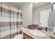 Bathroom featuring shower with striped shower curtain and a single vanity at 271 Learwood Ln, Atlanta, GA 30349