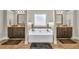 Bright bathroom featuring double vanities, a soaking tub, and neutral colors at 271 Learwood Ln, Atlanta, GA 30349