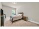 Comfortable bedroom featuring neutral decor, a plush carpet, and plenty of natural light at 271 Learwood Ln, Atlanta, GA 30349