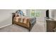 Comfortable bedroom featuring a large bed and a window with natural light at 271 Learwood Ln, Atlanta, GA 30349