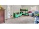 bedroom with carpet, bunk beds, green sofa, and large window at 271 Learwood Ln, Atlanta, GA 30349
