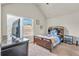 Bright bedroom with carpet, vaulted ceilings, and a large window at 271 Learwood Ln, Atlanta, GA 30349