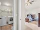 Bedroom featuring carpet, vaulted ceilings, and a door to the laundry room at 271 Learwood Ln, Atlanta, GA 30349
