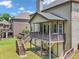 View of the covered deck with stairs to the yard and railing at 271 Learwood Ln, Atlanta, GA 30349