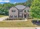 Charming two-story brick home with lush lawn and manicured landscaping at 271 Learwood Ln, Atlanta, GA 30349