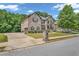 Attractive two-story home with brick facade, well-maintained landscaping, and a spacious driveway at 271 Learwood Ln, Atlanta, GA 30349