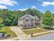 Beautiful home with a well-manicured lawn, brick exterior, and attached garage at 271 Learwood Ln, Atlanta, GA 30349