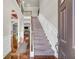 Inviting foyer with a grand staircase, hardwood floors, and elegant wainscoting, creating a welcoming entrance at 271 Learwood Ln, Atlanta, GA 30349