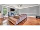 Cozy living room with hardwood floors, a stone fireplace, and a flat screen television at 271 Learwood Ln, Atlanta, GA 30349
