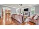 Spacious living room featuring hardwood floors, a fireplace, and an open layout to the kitchen at 271 Learwood Ln, Atlanta, GA 30349