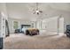 Spacious main bedroom featuring vaulted ceilings, neutral decor, and natural light at 271 Learwood Ln, Atlanta, GA 30349