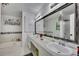 Bathroom featuring double sinks, granite counters, large tub and decorative touches at 3856 Nowlin Nw Rd, Kennesaw, GA 30144