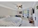 This cozy bedroom features a ceiling fan, soft carpet, and lots of natural light at 3856 Nowlin Nw Rd, Kennesaw, GA 30144