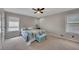 Cozy bedroom with natural light, ceiling fan and comfortable carpet at 3856 Nowlin Nw Rd, Kennesaw, GA 30144