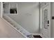 Bright foyer featuring a staircase, decorative door, and a charming wall decal at 3856 Nowlin Nw Rd, Kennesaw, GA 30144