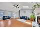 Bright and open living room with hardwood floors, fireplace, skylights, and vaulted ceilings at 3856 Nowlin Nw Rd, Kennesaw, GA 30144