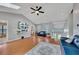 Bright living room featuring hardwood floors, fan, and modern decor at 3856 Nowlin Nw Rd, Kennesaw, GA 30144