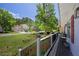 Inviting porch view with potted plants and seating overlooking the front yard and neighborhood at 3856 Nowlin Nw Rd, Kennesaw, GA 30144