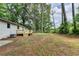 The backyard offers a deck and mature trees providing shade at 396 Independence Dr, Jonesboro, GA 30238