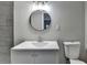 Updated bathroom offers a modern vanity, faucet and mirror at 396 Independence Dr, Jonesboro, GA 30238
