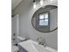 Bathroom features a new vanity, modern fixtures, and a shower-tub combo with a large mirror at 396 Independence Dr, Jonesboro, GA 30238