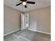 An empty bedroom offers a ceiling fan, neutral walls and attractive wood-look flooring at 396 Independence Dr, Jonesboro, GA 30238