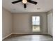 This bedroom features hardwood floors, a ceiling fan, and a window with lots of natural light at 396 Independence Dr, Jonesboro, GA 30238